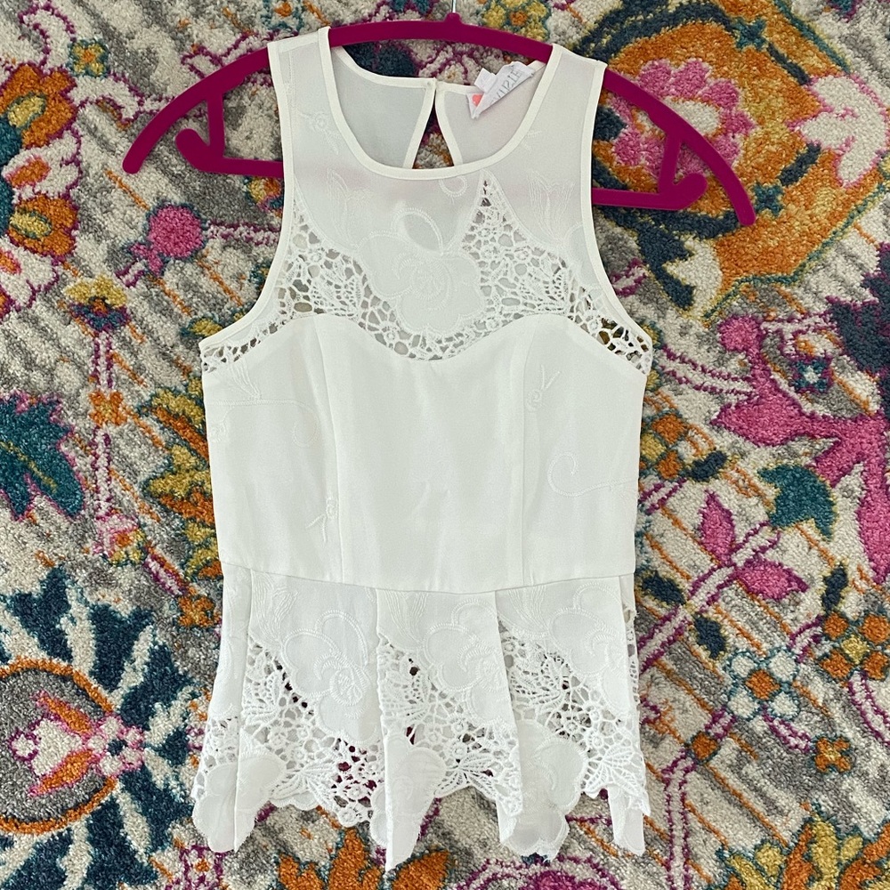 White embroidered peplum top